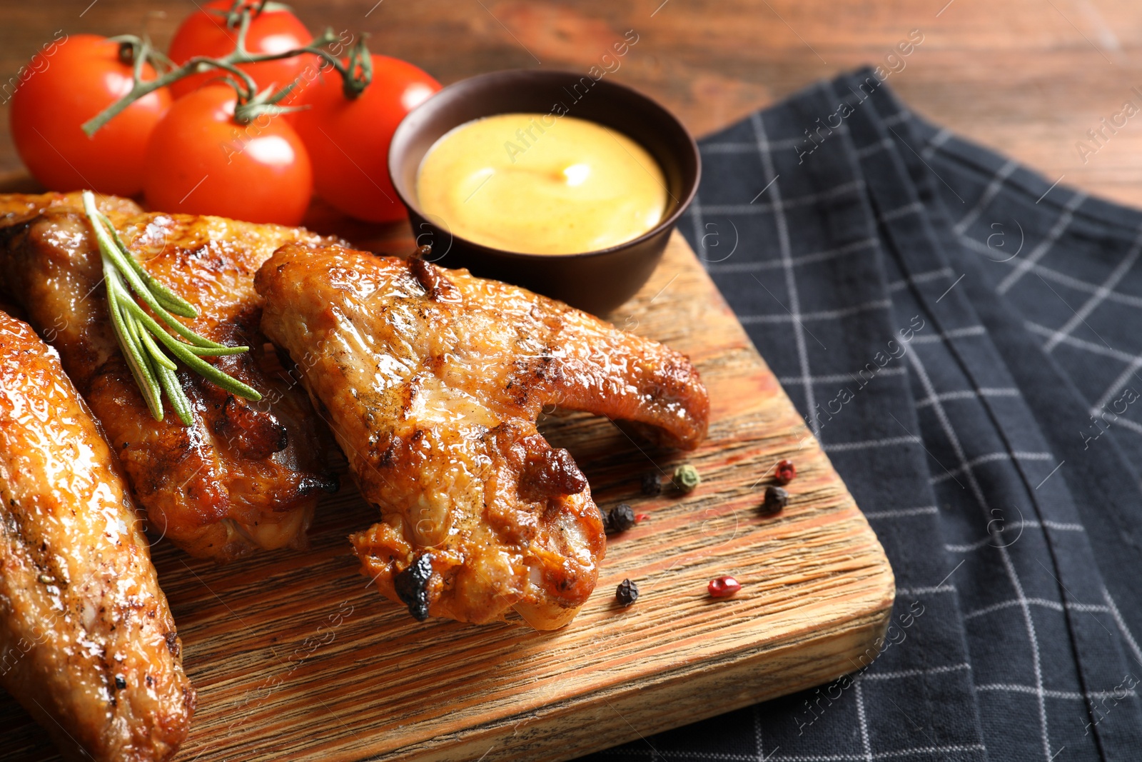 Photo of Delicious meat served for barbecued party on wooden table