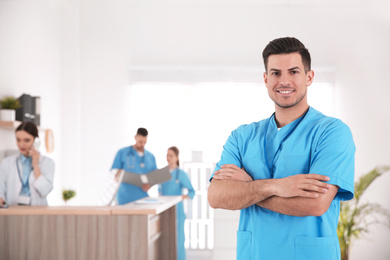 Photo of Portrait of male doctor in modern clinic