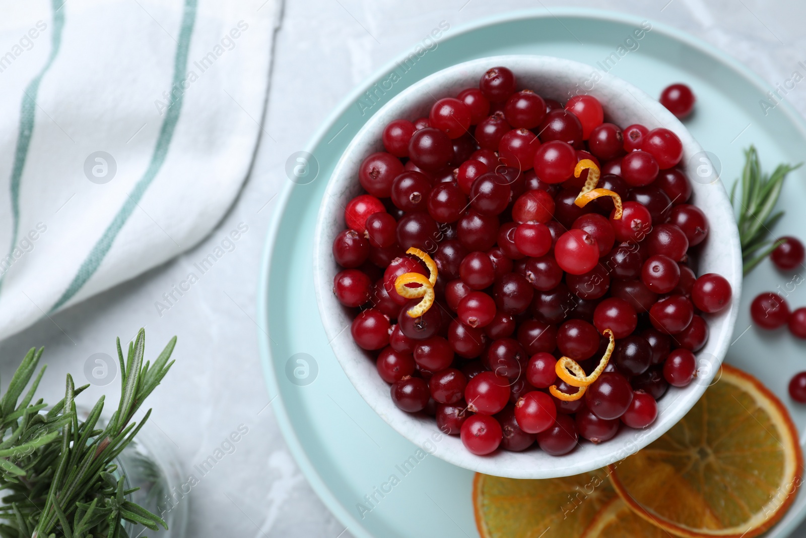 Photo of Flat lay composition with fresh ripe cranberries on grey table