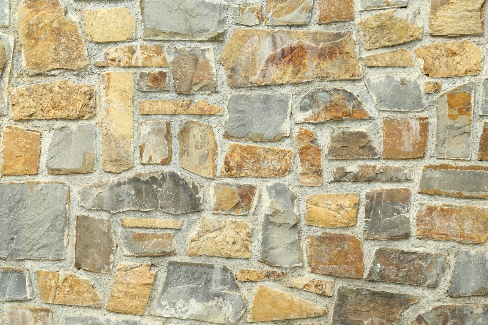 Photo of Texture of stone wall as background, closeup