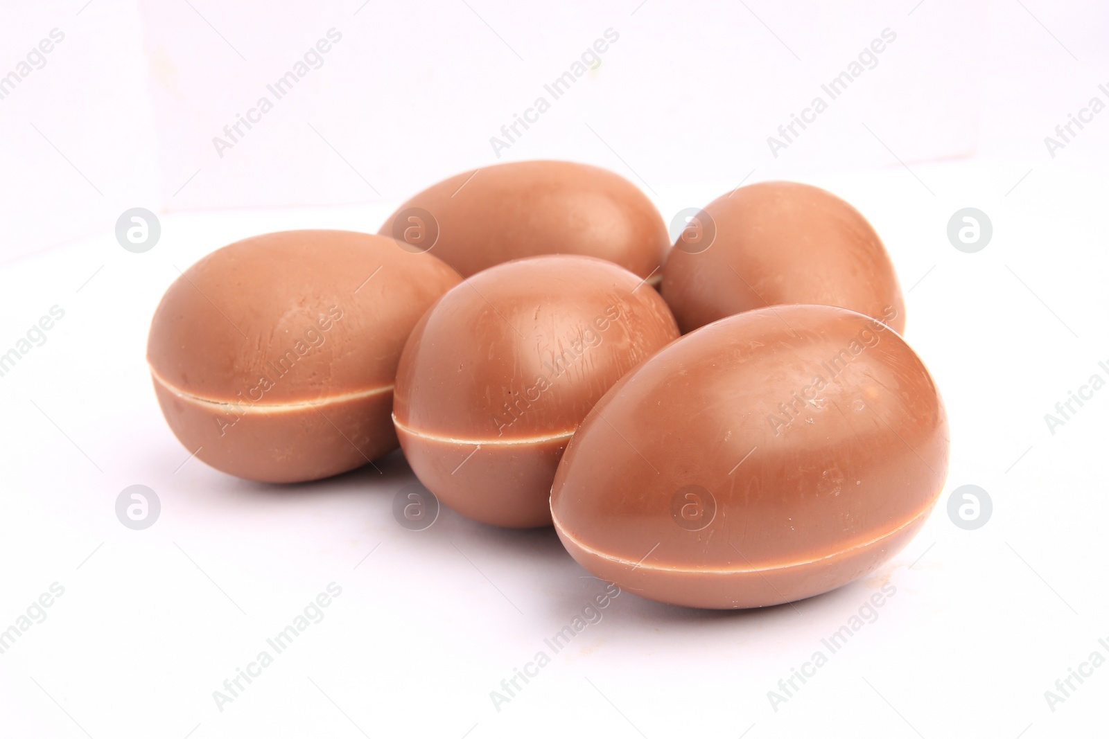 Photo of Sveti Vlas, Bulgaria - June 27, 2023: Unwrapped Kinder Surprise Eggs isolated on white