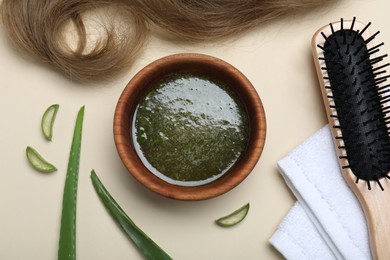 Flat lay composition with homemade hair mask and ingredients on beige background