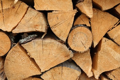 Photo of Pile of chopped firewood as background, closeup