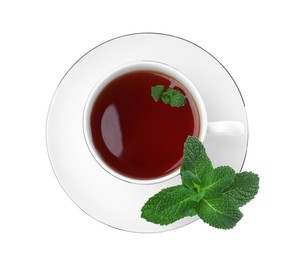 Photo of Cup of aromatic black tea with fresh mint on white background, top view