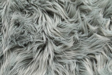 Photo of Texture of grey faux fur as background, top view