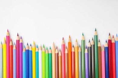 Photo of Many colorful wooden pencils on white background, flat lay. Space for text