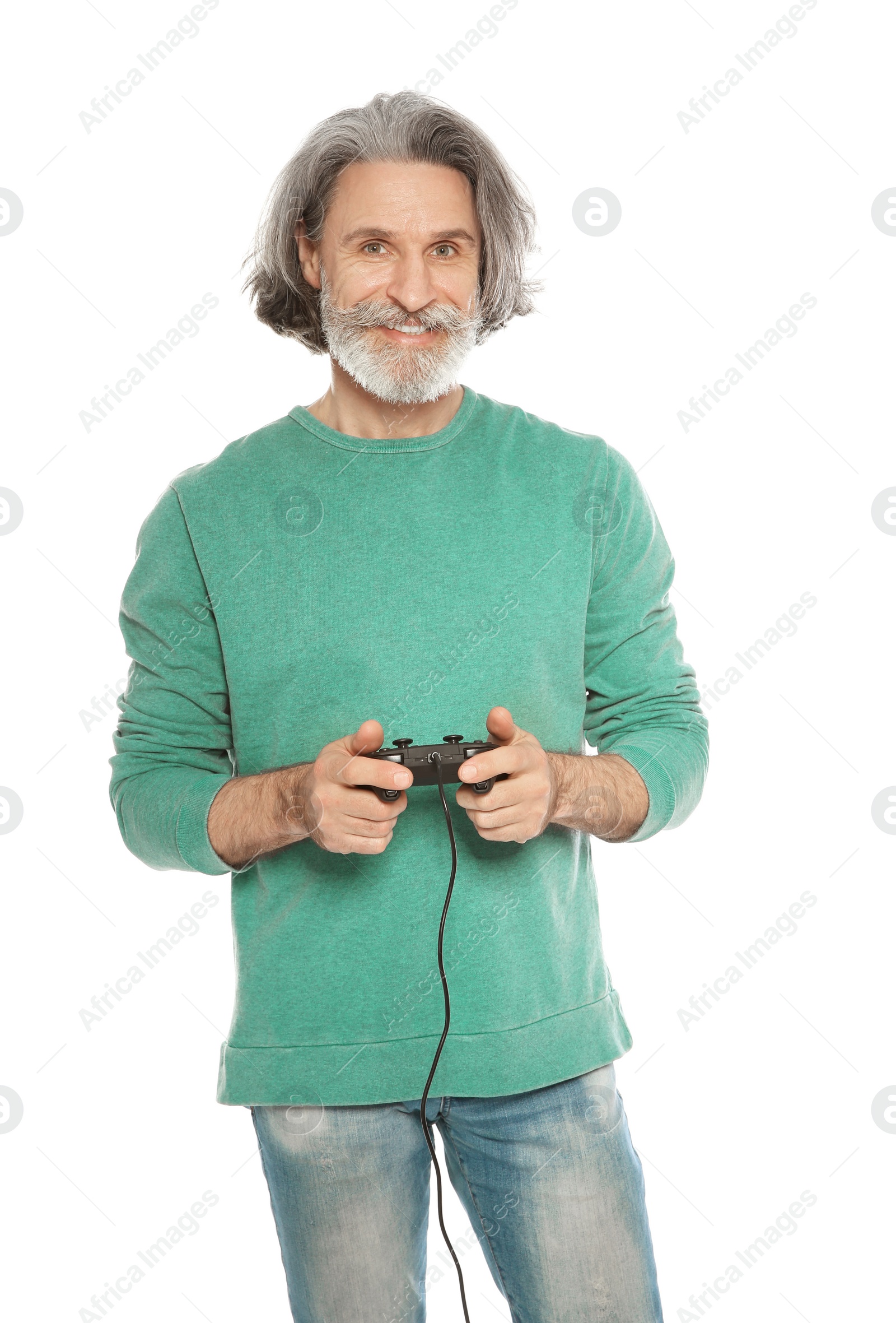 Photo of Emotional mature man playing video games with controller isolated on white