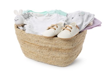 Photo of Laundry basket with baby clothes, shoes and toy isolated on white