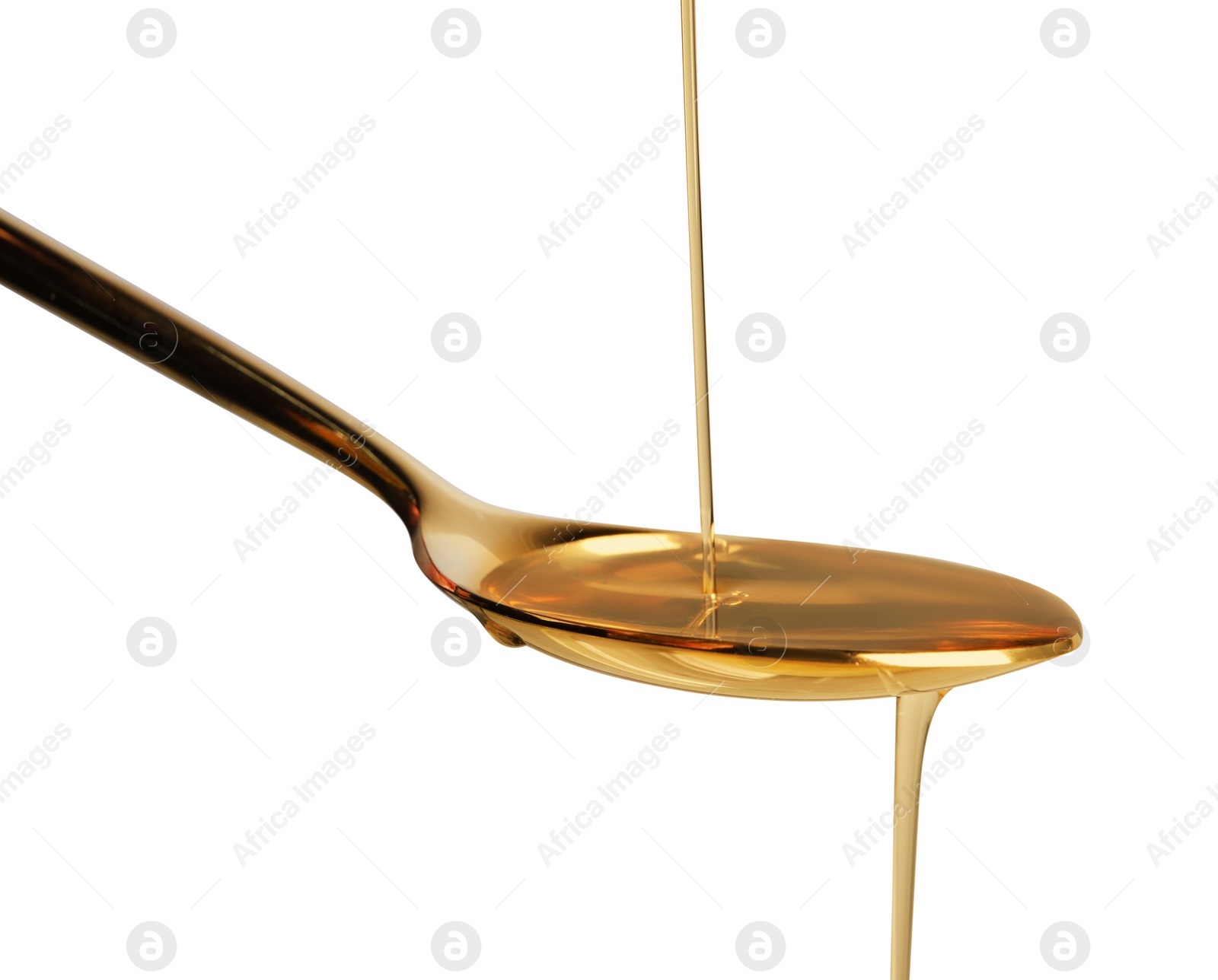 Photo of Pouring cooking oil into spoon on white background