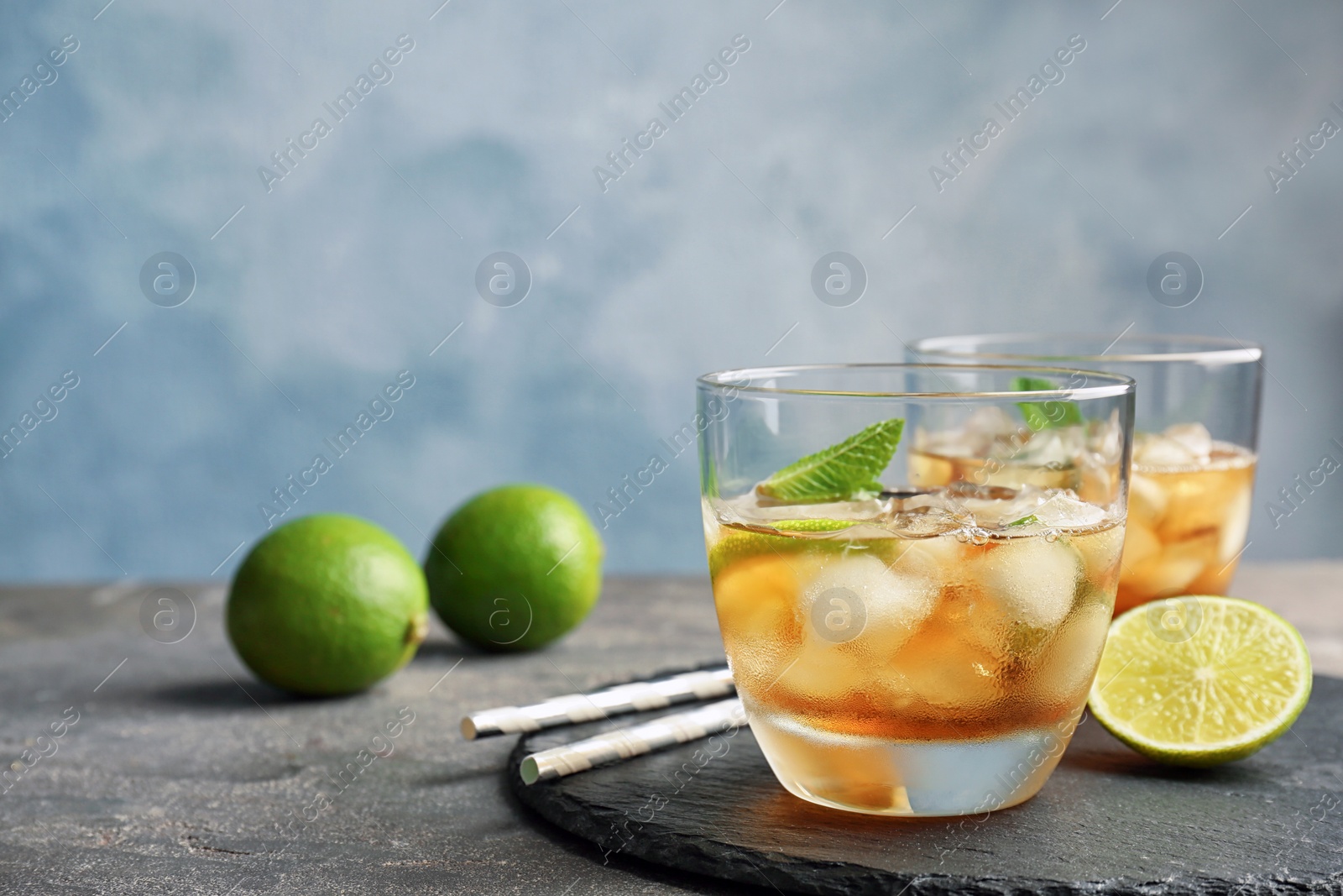 Photo of Delicious mint julep cocktail on slate plate