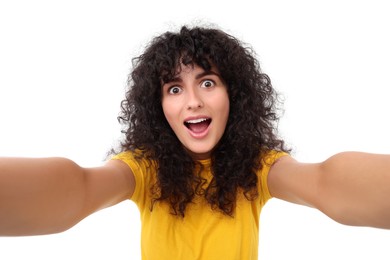 Photo of Beautiful young woman taking selfie on white background