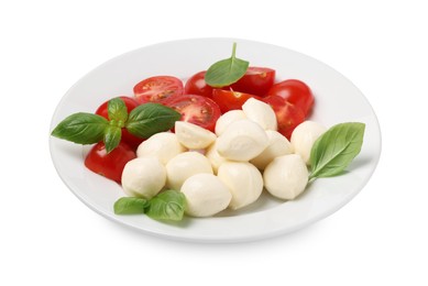 Plate of delicious Caprese salad with tomatoes, mozzarella and basil isolated on white