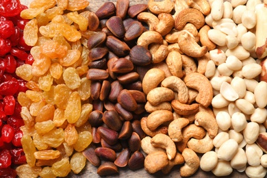 Different dried fruits and nuts as background, closeup