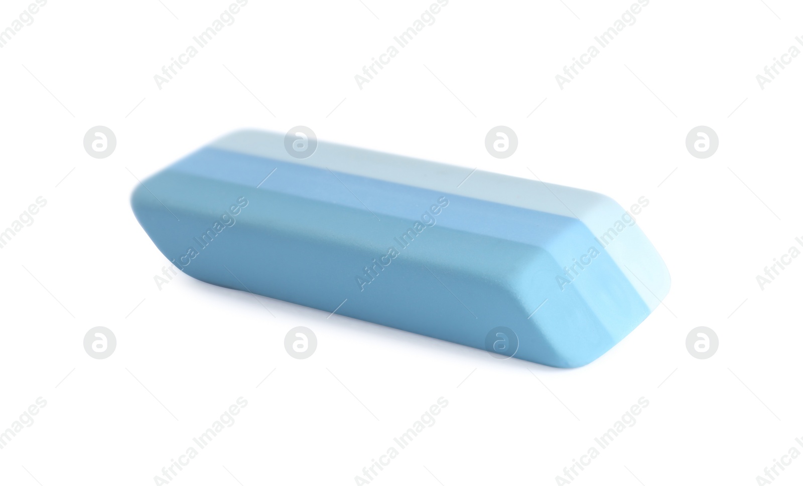 Photo of New bright eraser isolated on white. School stationery