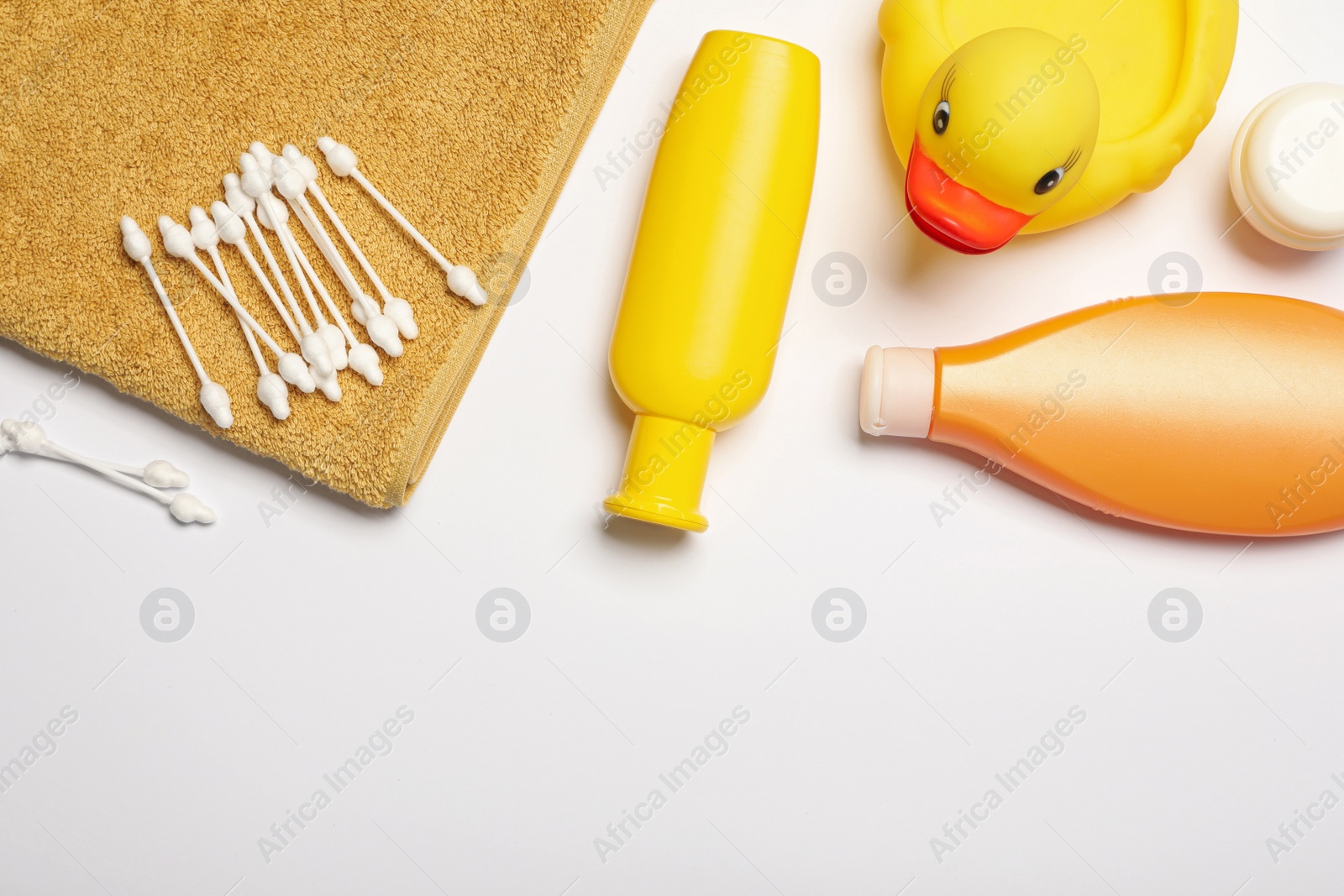 Photo of Flat lay composition with baby cosmetic products on white background, space for text