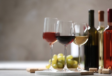 Different glasses with wine served on table