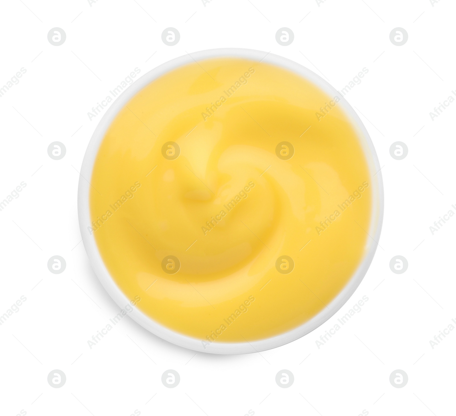 Photo of Delicious cheese sauce in bowl isolated on white, top view