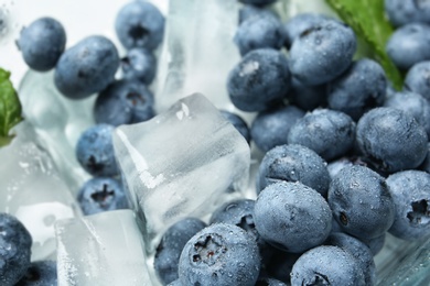 Photo of Juicy and fresh blueberries with and ice, closeup