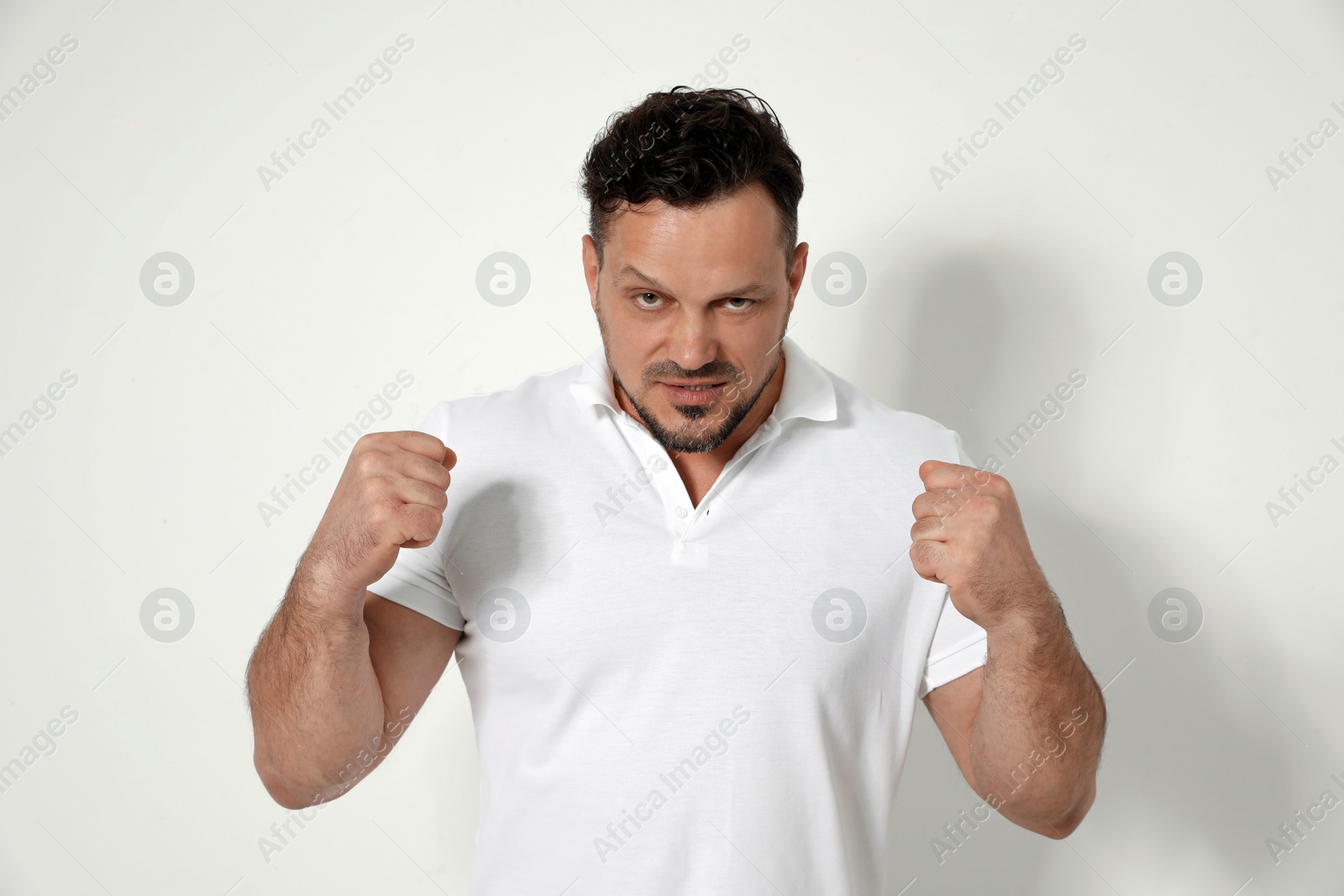 Photo of Portrait of emotional man on white background