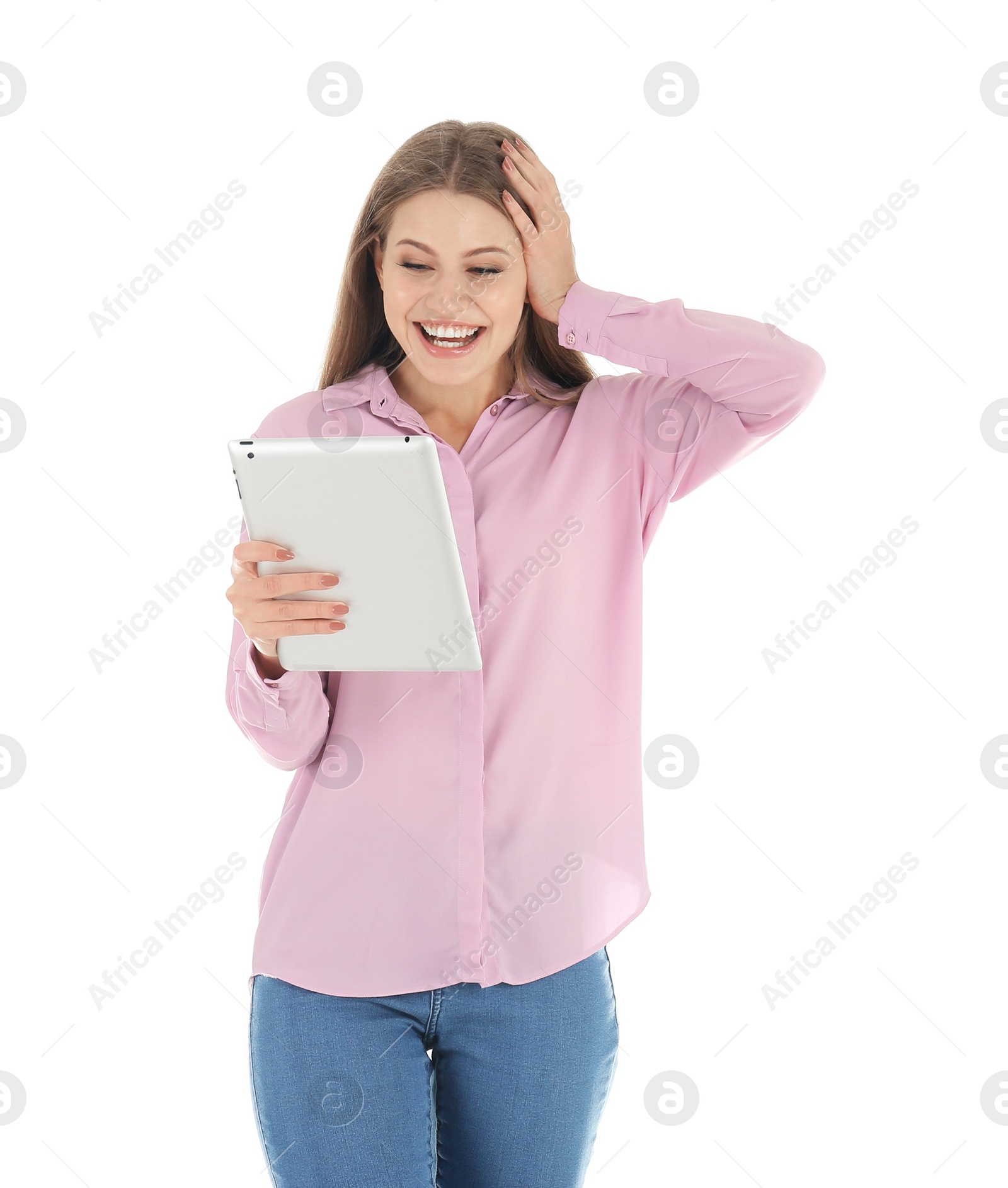 Photo of Emotional young woman with tablet celebrating victory on white background