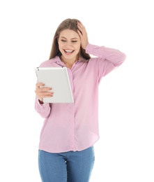 Emotional young woman with tablet celebrating victory on white background