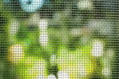 Photo of Insect screen for window against blurred background, closeup