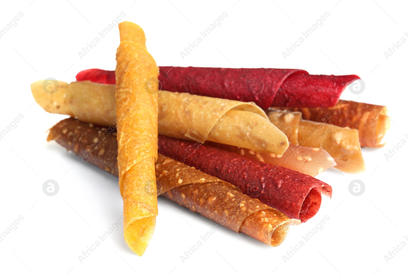 Photo of Delicious fruit leather rolls on white background