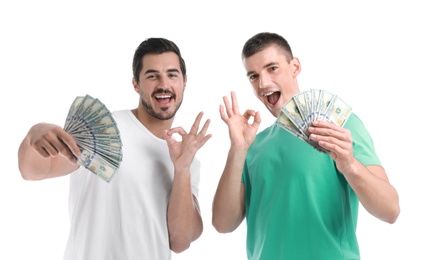Photo of Handsome young men with dollars on white background