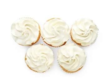 Photo of Tasty vanilla cupcakes with cream isolated on white, top view