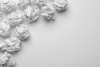 Crumpled sheets of paper on white background, top view