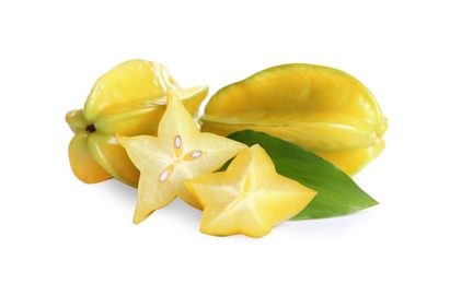 Photo of Cut and whole carambolas with green leaf on white background