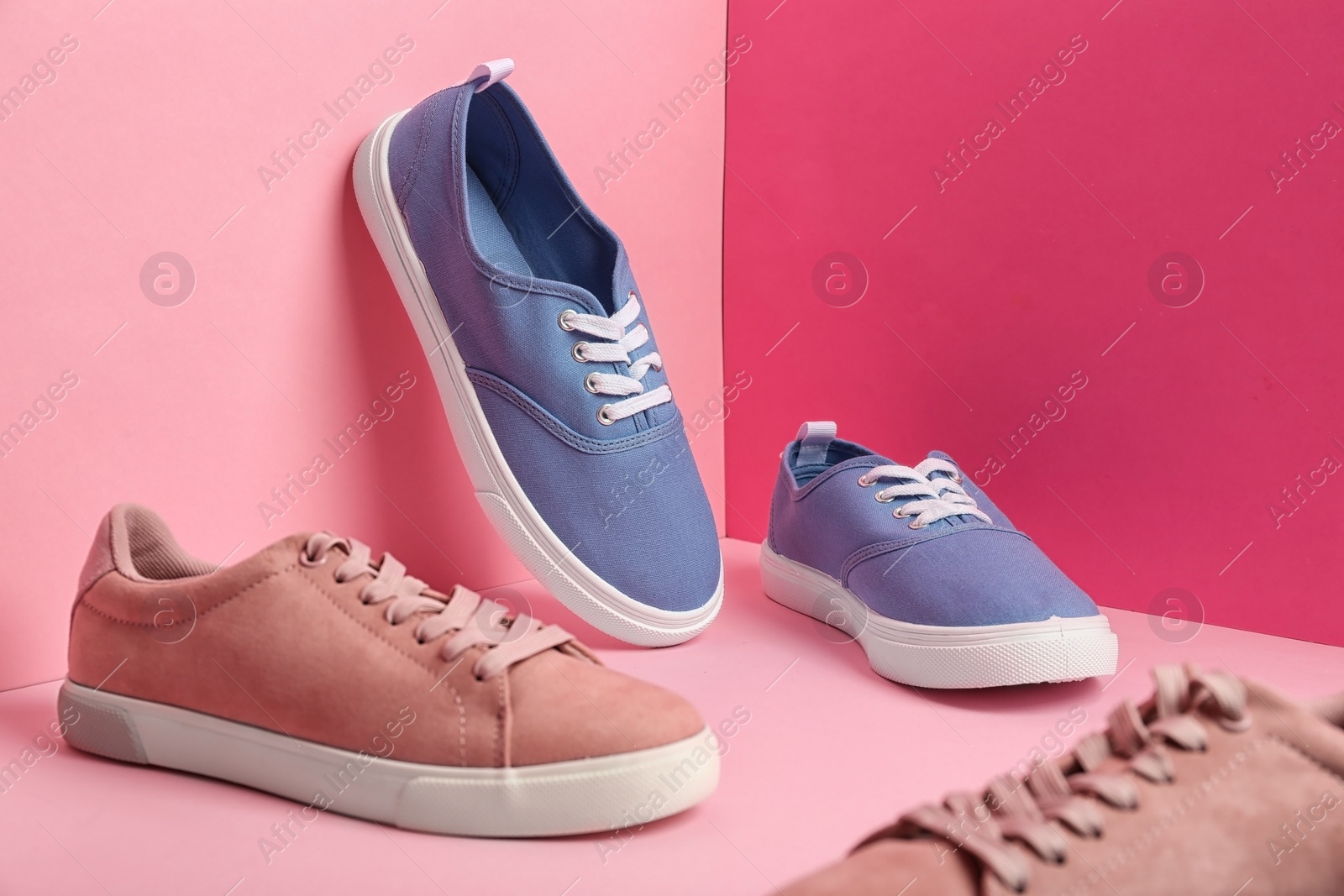 Photo of Comfortable sneakers on color background, space for text