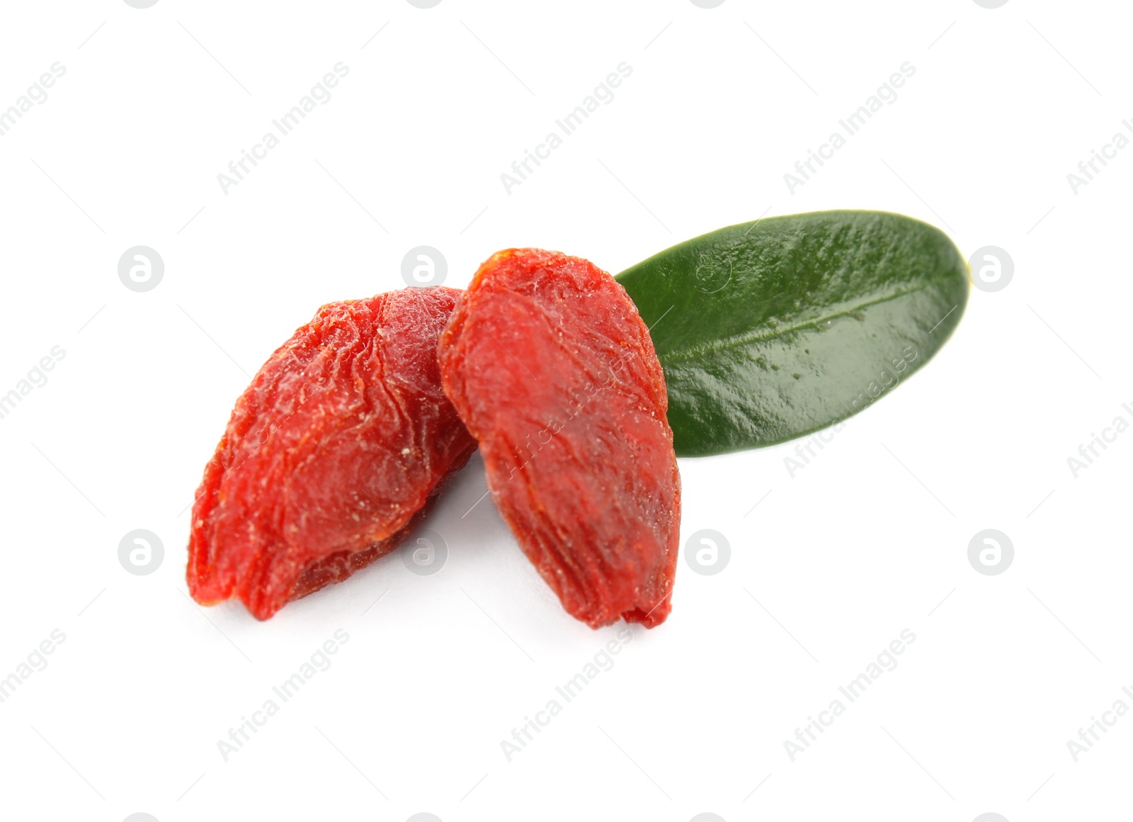 Photo of Dried goji berries and leaf on white background