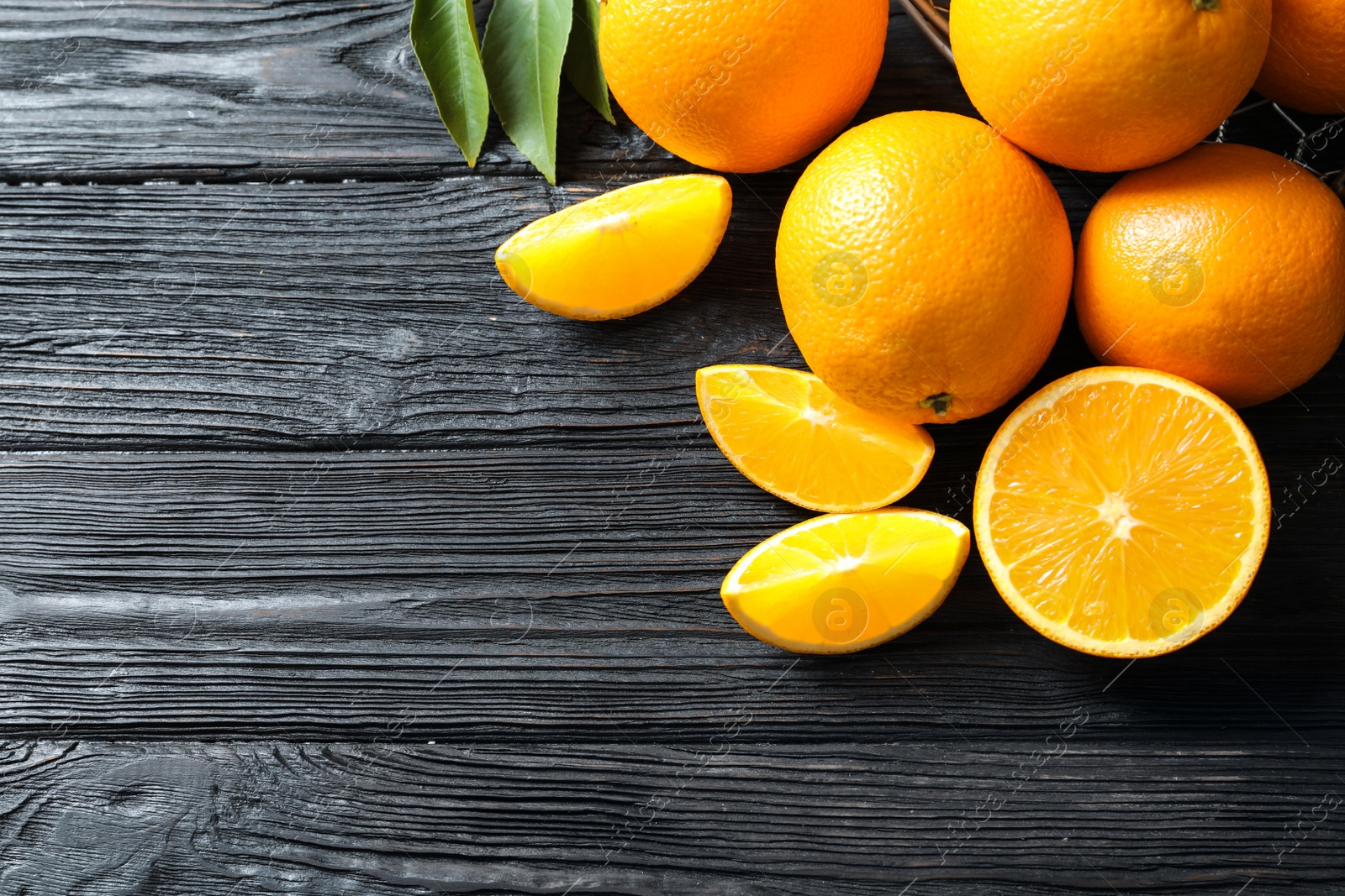 Photo of Flat lay composition with ripe oranges and space for text on wooden background