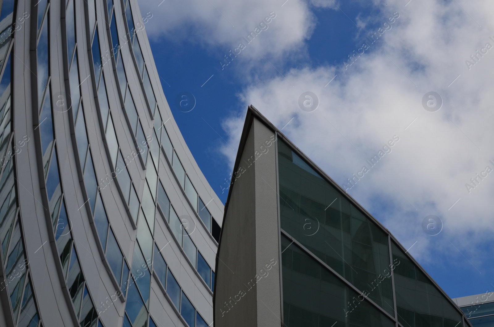 Photo of Exterior of beautiful buildings against blue sky, low angle view