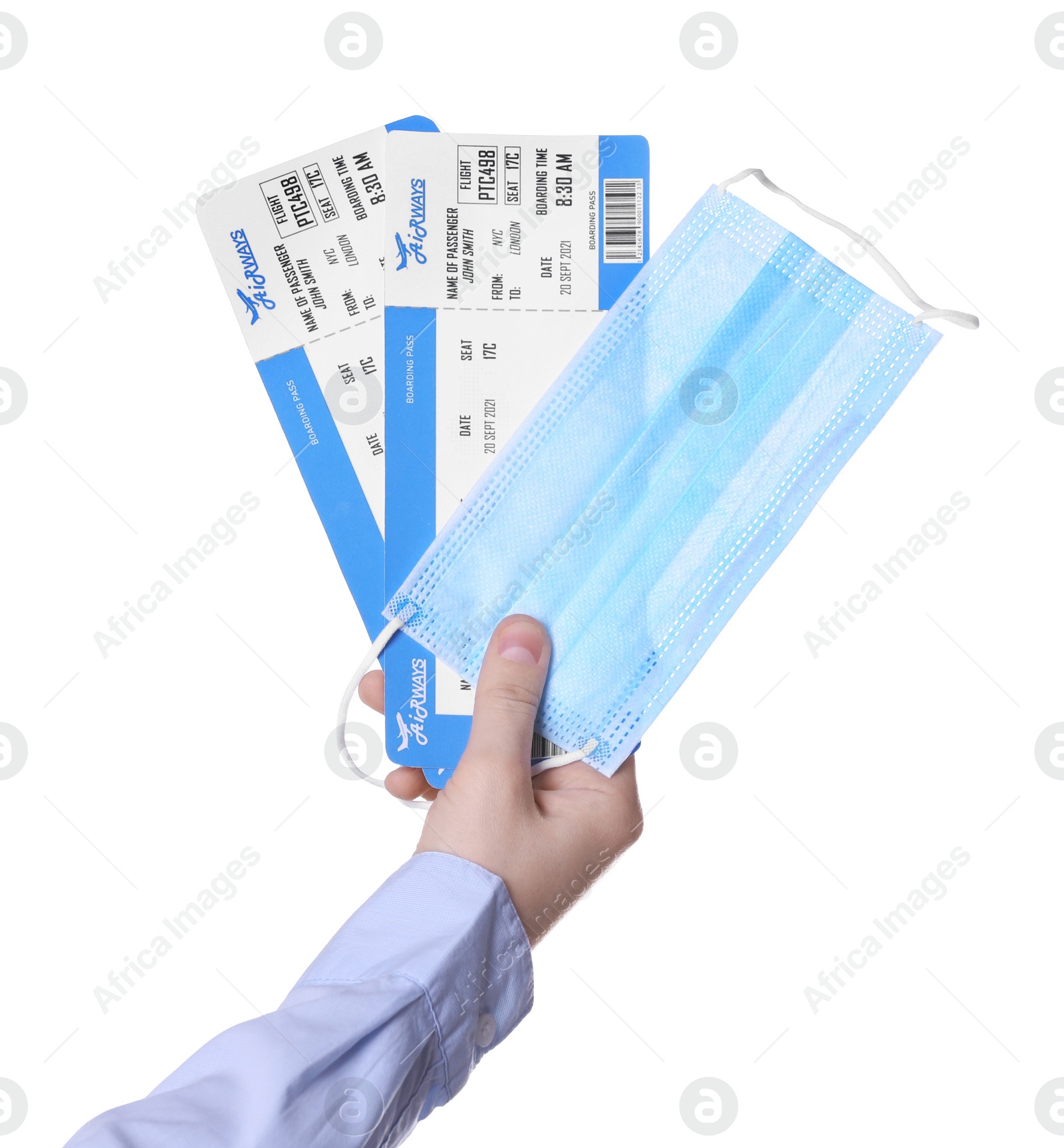 Photo of Woman holding tickets and protective mask on white background, closeup. Travel during quarantine