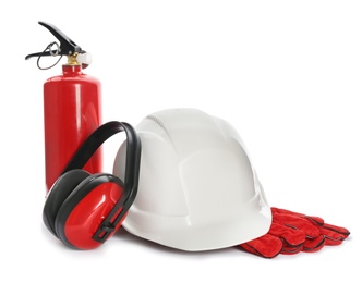 Photo of Protective workwear and fire extinguisher on white background. Safety equipment