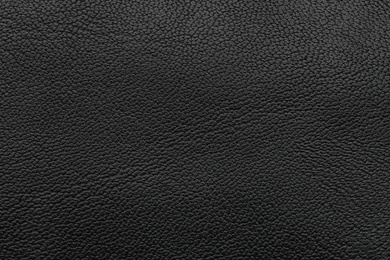 Texture of black leather as background, closeup