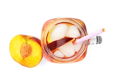 Photo of Delicious refreshing peach cocktail in mason jar on white background, top view