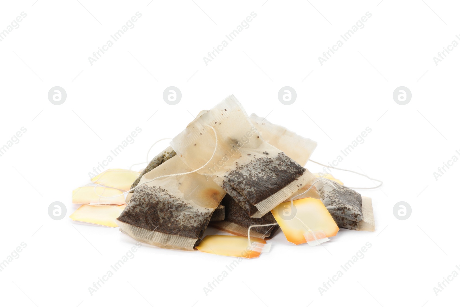 Photo of Many used tea bags on white background