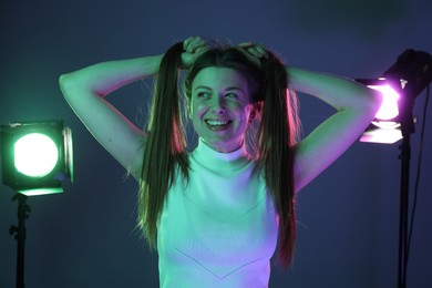 Photo of Portrait of beautiful young woman in photo studio