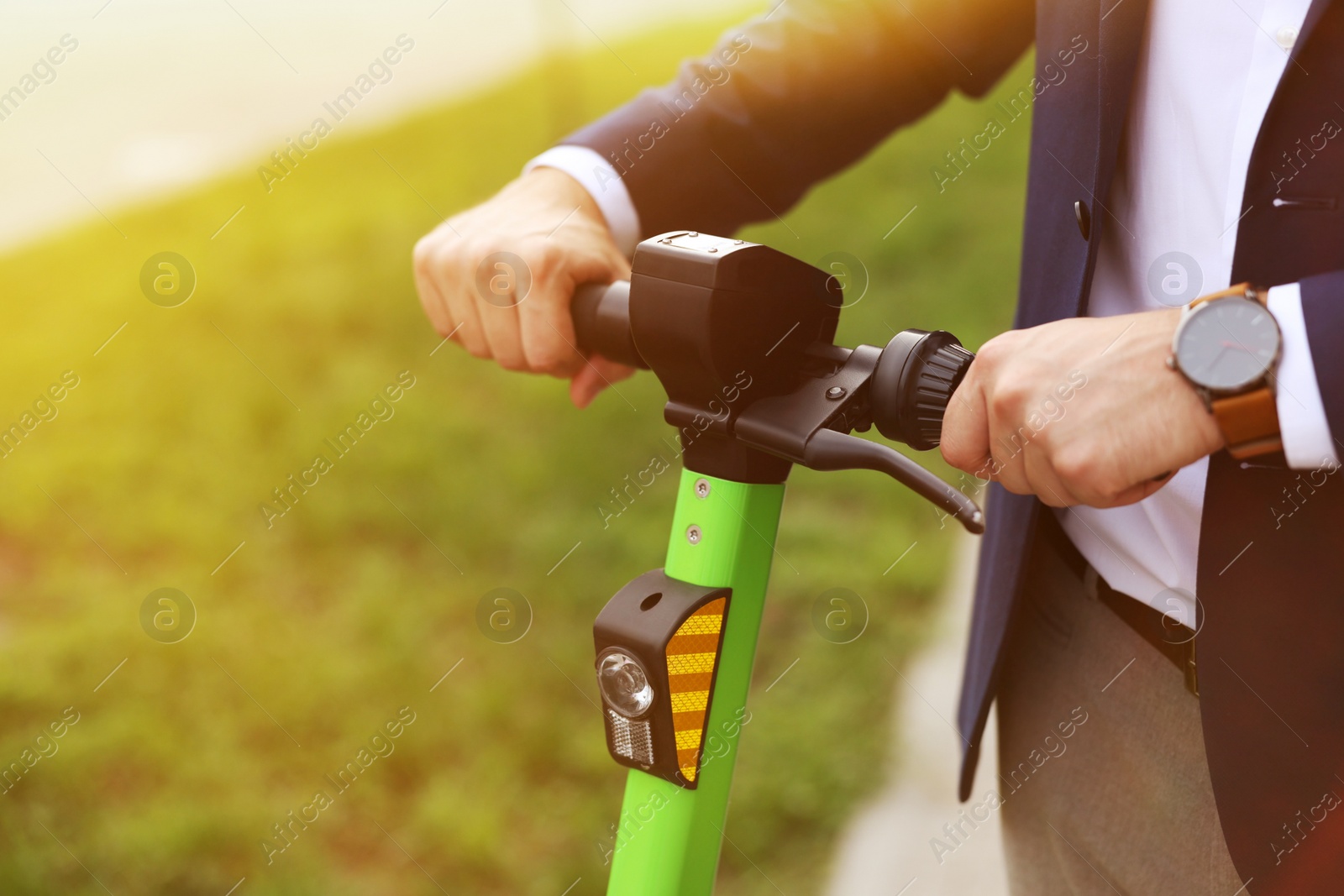 Photo of Businessman with modern kick scooter outdoors, closeup. Space for text