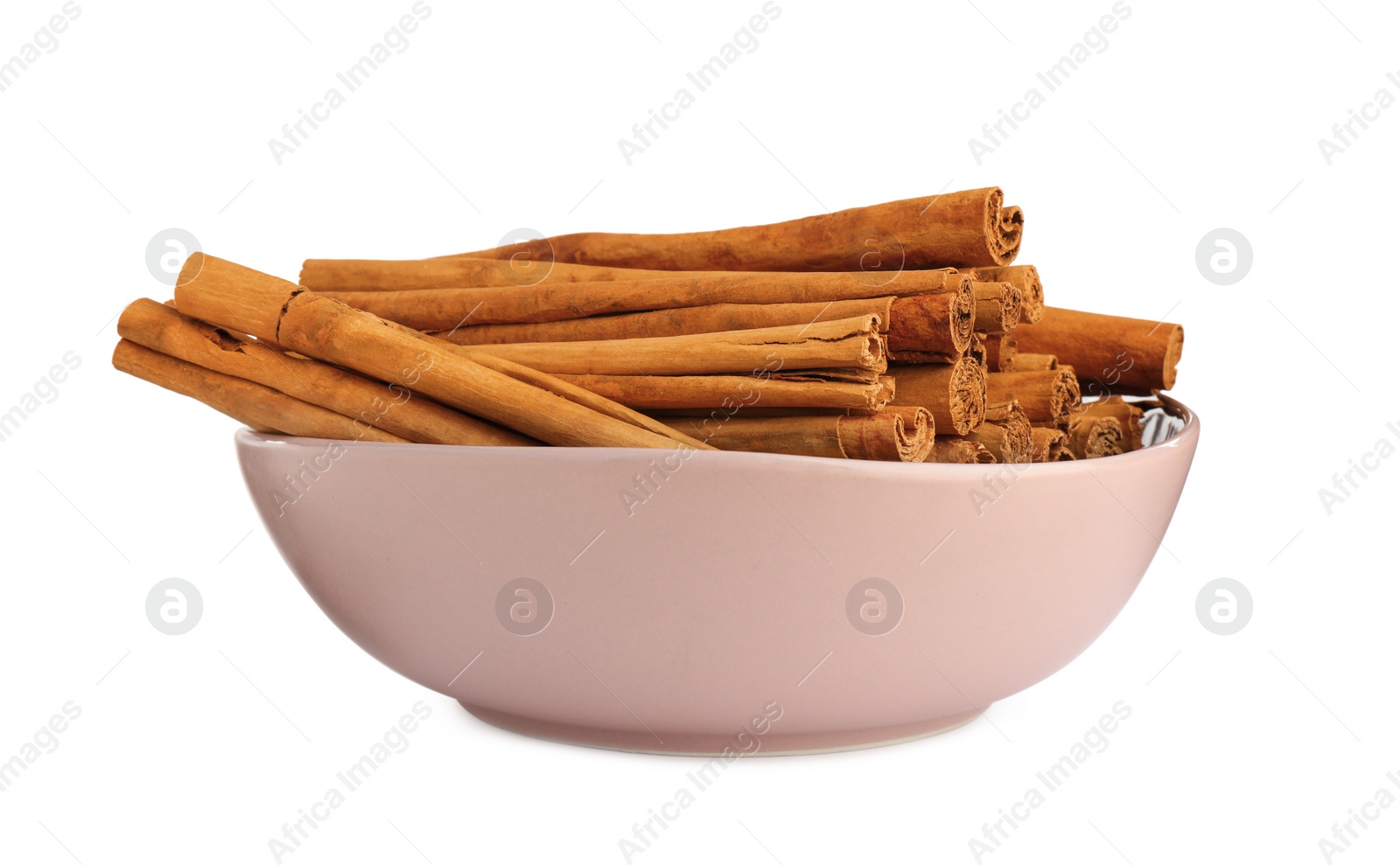 Photo of Aromatic dry cinnamon sticks in bowl on white background