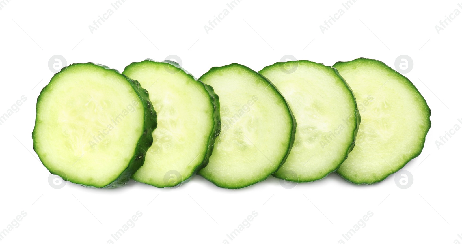 Photo of Slices of fresh ripe cucumber isolated on white