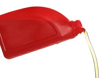 Photo of Man pouring motor oil from red container on white background, closeup
