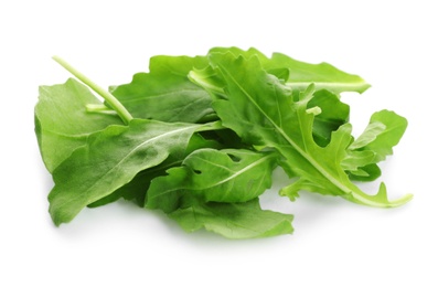 Fresh green arugula leaves on white background