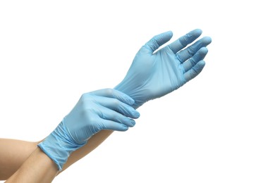 Photo of Doctor wearing light blue medical gloves on white background, closeup