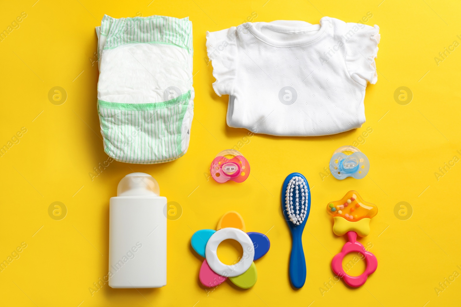 Photo of Flat lay composition with baby accessories on color background