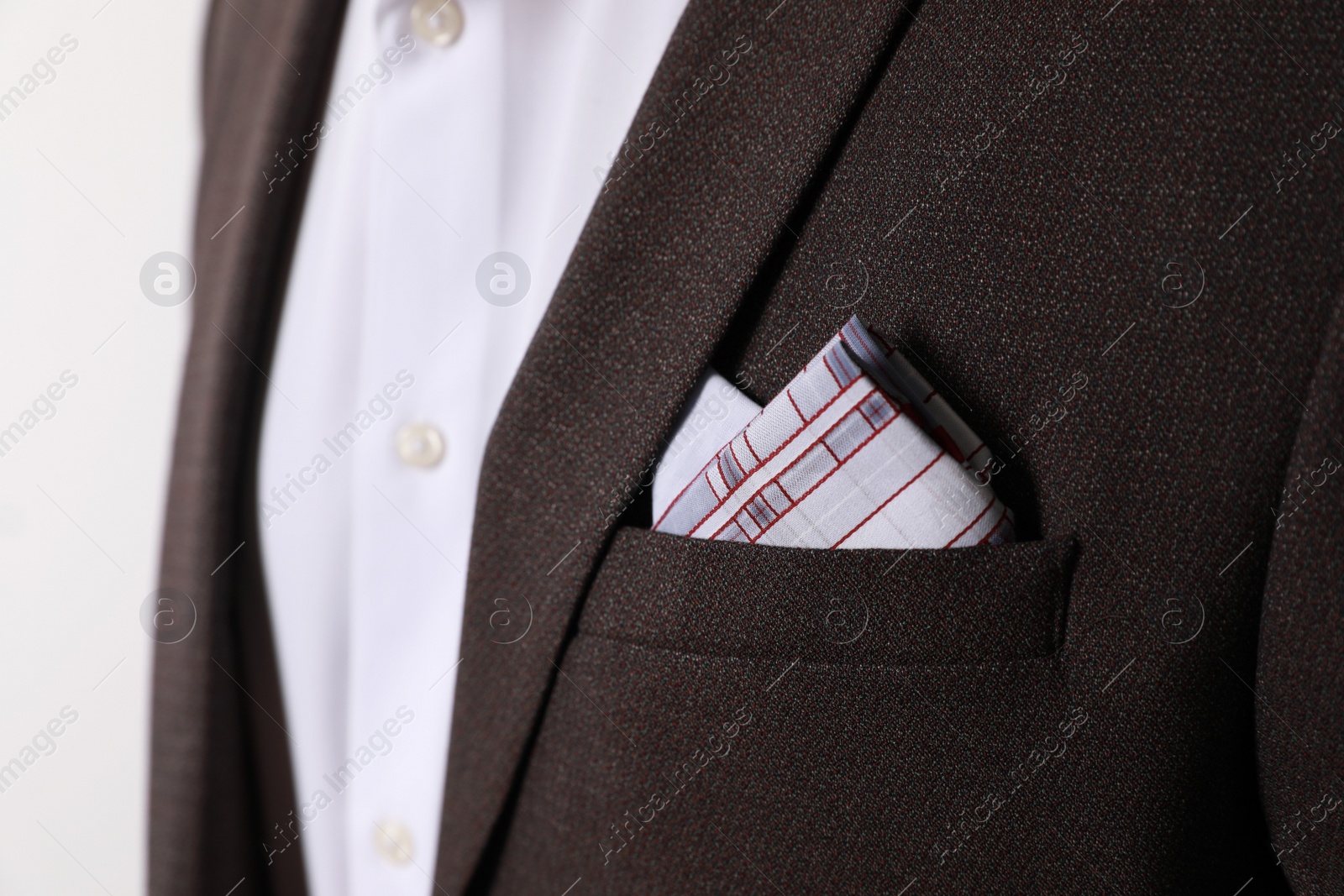 Photo of Man with handkerchief in suit pocket on white background, closeup