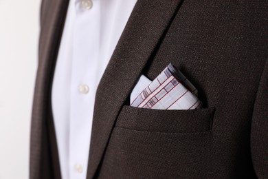 Photo of Man with handkerchief in suit pocket on white background, closeup